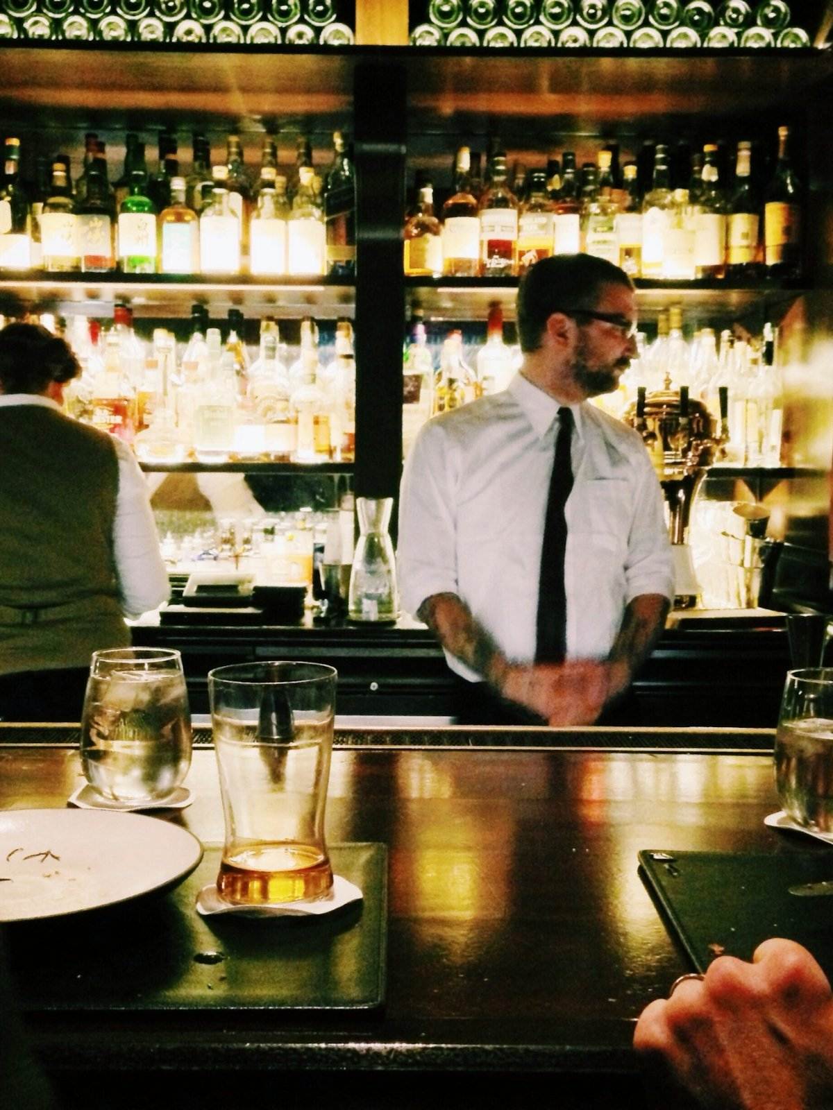 Bartender behind a restaurant bar